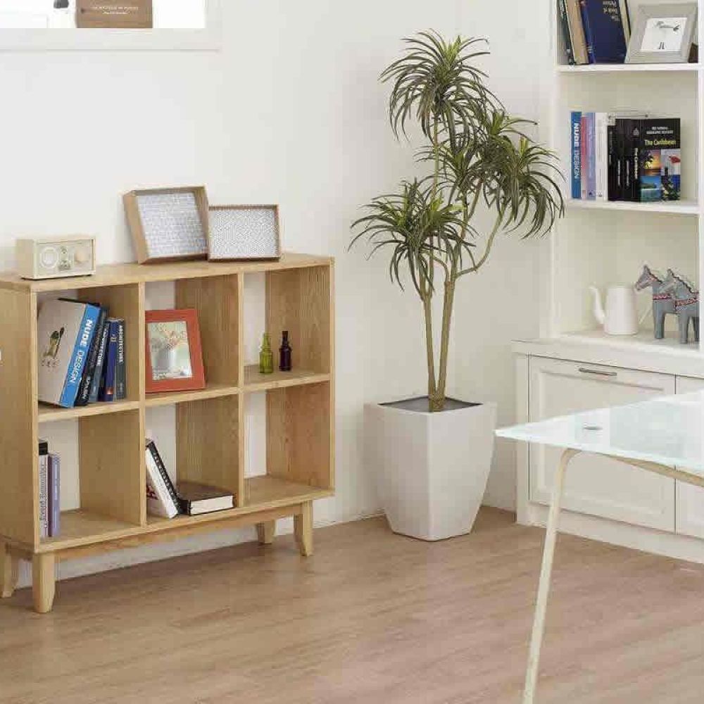 <span class="uk-h4">A home office with a white desk, a computer, bookshelves, and decorative plants, providing a clean and organized workspace.</span>